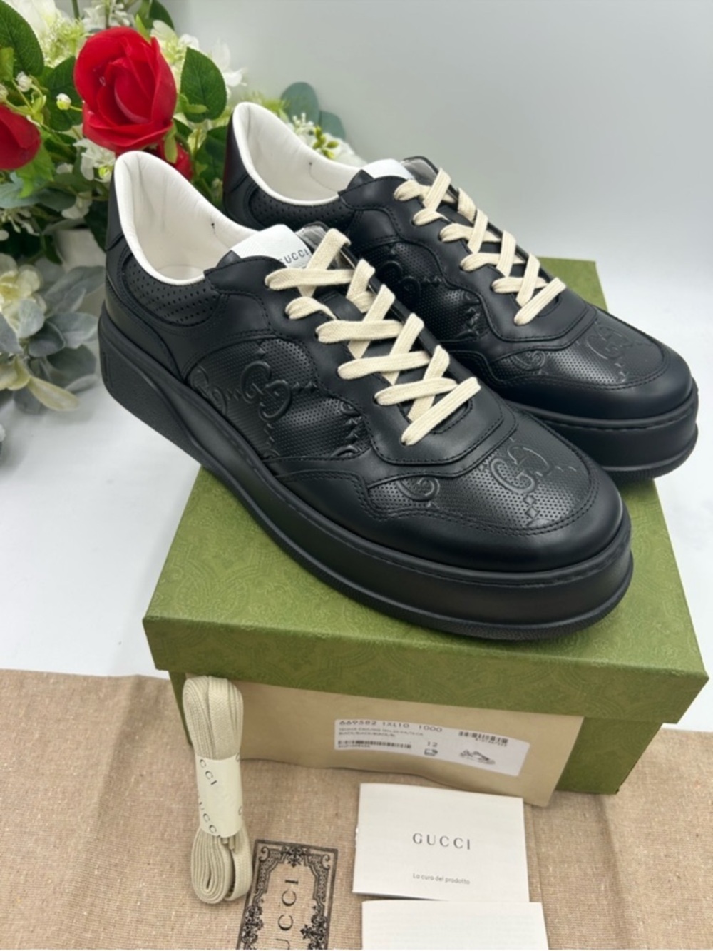 Men's Gucci, GG embossed leather sneakers size 12 made in Italy. Black.